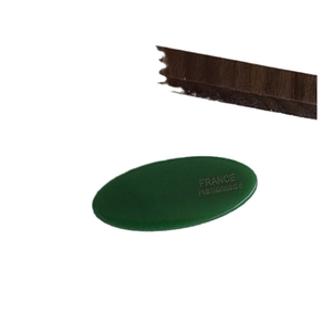 Deep green oval France Handmade acetate hair clip with gold foil lettering on white background