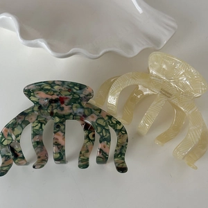 Pinces à cheveux citrouille en acétate avec motifs colorés en écaille et crème