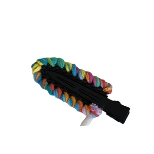 Colorful hand-knitted wool duckbill hair clip with vibrant rainbow yarn border on black base