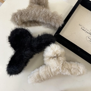 Three-piece plush hair claw clips in black, brown, and cream for autumn winter styling