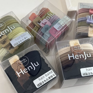 Elastic seamless hair ties set in box with leather charms featuring animal patterns