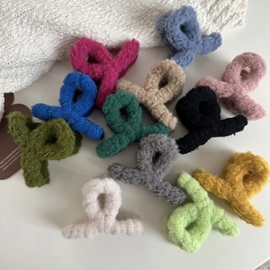 Plush cross hair claw clips in various colors for autumn and winter hair styling