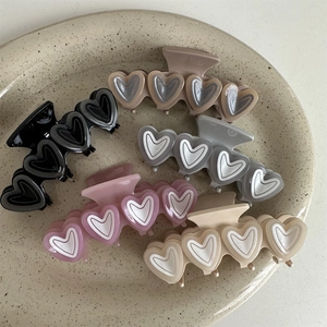 Set of 5 French jelly double heart hair claws in Morandi tones displayed on a ceramic tray