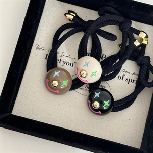 Three-piece colorful clown elastic hair ties with star patterns and smile charms