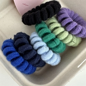 Set of seven colorful knitted telephone cord hair ties in assorted vibrant candy colors
