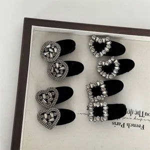Detailed macro view of flocking velvet hair clips with sparkling rhinestone inlay set