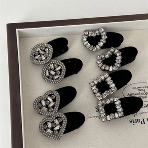 Detail of velvet flocking hair clips with sparkling rhinestones in heart and square shapes