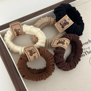 Elastic ribbed hair scrunchies with cute bear label in earthy tones for high ponytail