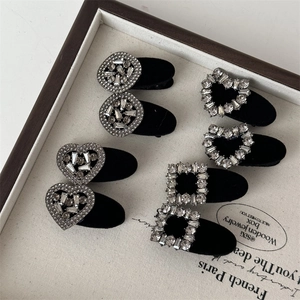 Detail of 8pcs set of black velvet hair clips with sparkling rhinestone geometric shapes