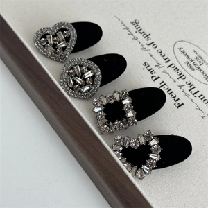Set of four black velvet hair clips featuring square and heart-shaped rhinestones