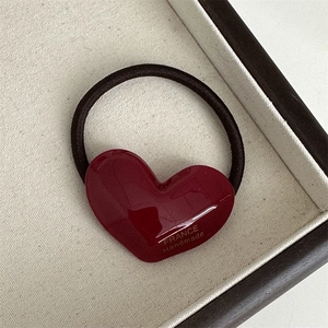 Detail of red 3D heart acetate charm with golden France Handmade stamp on elastic hair tie