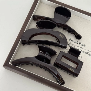 Elegant deep brown acetate hair claw set with four vintage styles and gold logo lettering