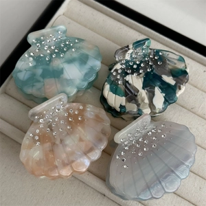 Shell-shaped acetic hair claws with rhinestones and marble texture in various colors