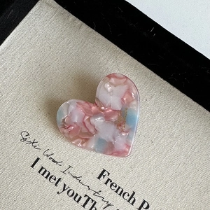 Pink and blue marble heart hair clip with France Handmade text on cream fabric