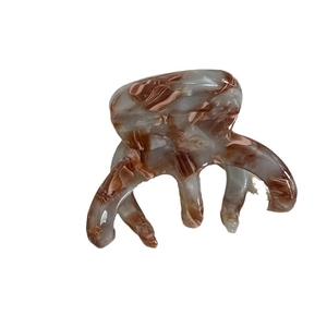 Marbled brown hair claw clip with octopus design for secure styling and French texture