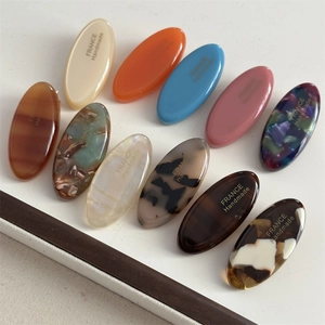 Handmade oval acetate hair clips in assorted marble and tortoiseshell patterns