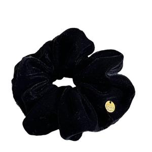 Classic black velvet scrunchie with a gold 'Hand Made' charm on a white background
