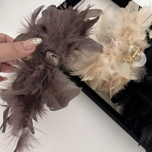 Elegant large ostrich feather hair claw clip with bow decoration in three colors