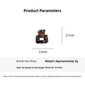Macro detail of tortoiseshell acetate mini hair claw clip measuring 2.2cm by 2.7cm