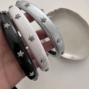 Three-piece set of star-studded padded headbands in black, white and silver finishes