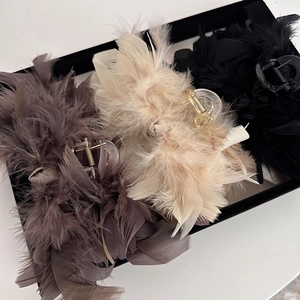 Ostrich feather hair claw clips in black, beige, and grey colors for women hair styling