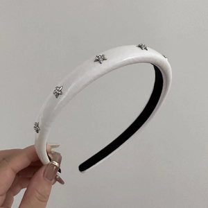 Thick beige sponge headband with silver star rhinestone details and non-slip inner grip