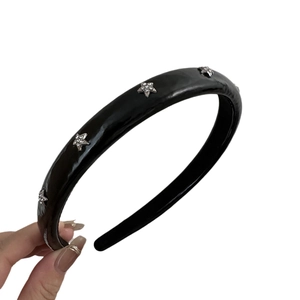 Chic black star headband for women with sparkling silver rhinestones and glossy finish