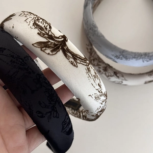 Elegant wide satin headband with vintage floral print and padded high-top design