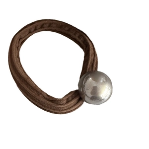 Champagne elastic hair tie with a silver glossy ball bead on a brown velvet band