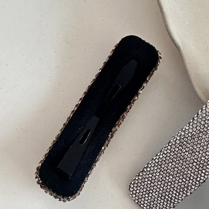 Minimalist rhinestone hair clip with velvet back and sparkling crystals in 45-degree view