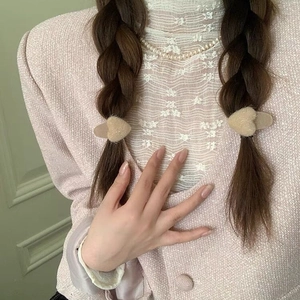 Elegant plush heart hair clip in khaki faux fur styled on braided hair accessory