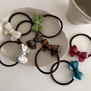 Elegant bow hair ties in acetate with gold accents and high-elastic rubber bands