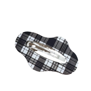 Black and white checkered hair clip with a wavy edge and silver metal BB snap button