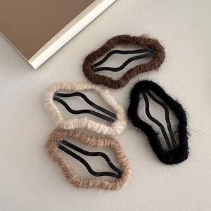 Set of four plush cloud hair clips in earthy tones with soft wool yarn wrap texture