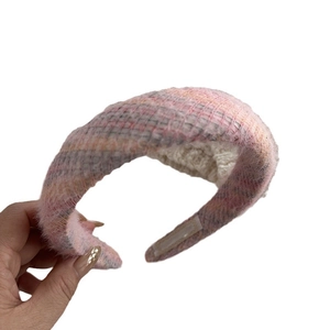 Thick fluffy knitted headband in pink and grey mix for women with soft plush texture