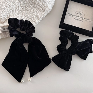 Elegant black velvet bow hair tie set with pearl pendants in a retro vintage style