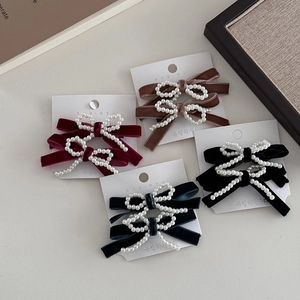 Handmade velvet bow hair clips with pearls in burgundy, brown, green, and black colors