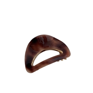 Creamy leopard print acetate hair claw with golden metal trim for vintage women styling