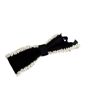 Elegant black fabric bow hair clip with white bead trim edges for women's hair styling