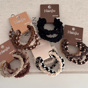 Set di 5 elastici per capelli intrecciati in marrone, nero e fantasia a pois