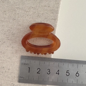 Elegant tortoise shell acetate hair claw clip with France Handmade engraving shown with ruler