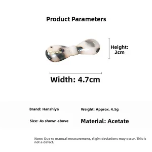 Detail view of acetate bow hair clip with tortoiseshell pattern and 4.7cm dimensions