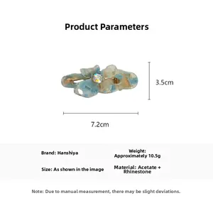 Detail view of acetate flower hair clip with rhinestone showing 7.2cm by 3.5cm size
