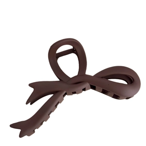 Matte dark brown large bow hair claw clip for elegant women styling in minimalist white background
