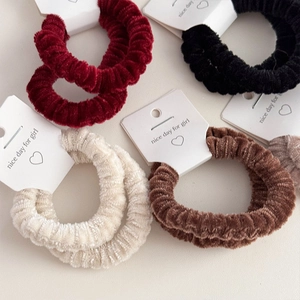 Set of two plush elastic scrunchies in velvet corduroy fabric for elegant hair styling