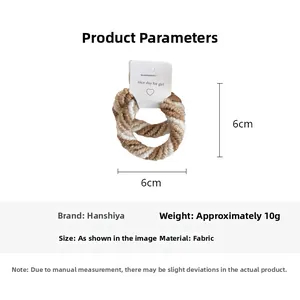 Detail view of the brown and white striped hair tie with 6cm x 6cm dimensions