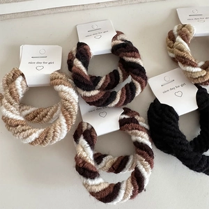 Multi-strand braided hair ties in coffee tones and black with spiral twist texture