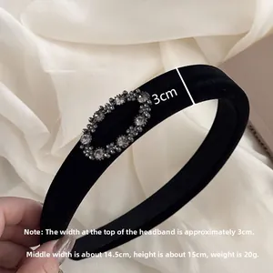 Detail view of black velvet headband showing oval rhinestones and 3cm wide dimensions