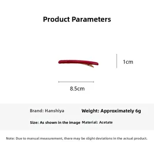Vue détaillée de la pince à cheveux rouge en acétate avec dimensions 8,5 cm par 1 cm