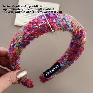Detailed close-up of thick multi-color tweed headband with premium braided wool texture